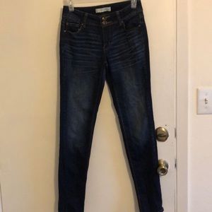 Dark wash mid rise blue jeans